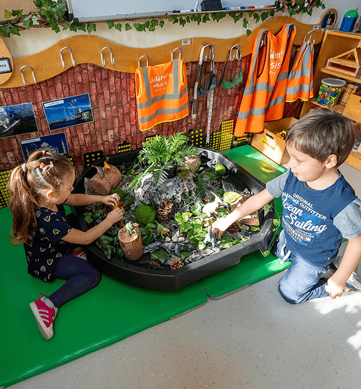 Children learning at Curiosity Cottage, Forest Oasis Nursery